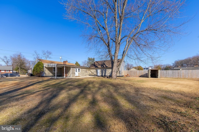 view of yard featuring fence