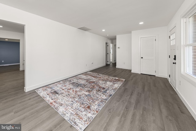 interior space with recessed lighting, visible vents, baseboards, and wood finished floors