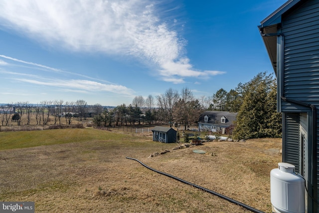 view of yard with a storage shed and an outdoor structure