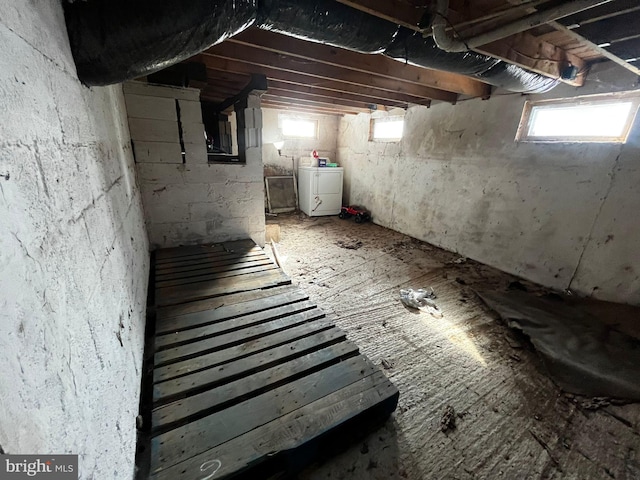 basement with washer / clothes dryer and a wealth of natural light