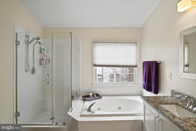 full bath with lofted ceiling, a stall shower, vanity, and a whirlpool tub