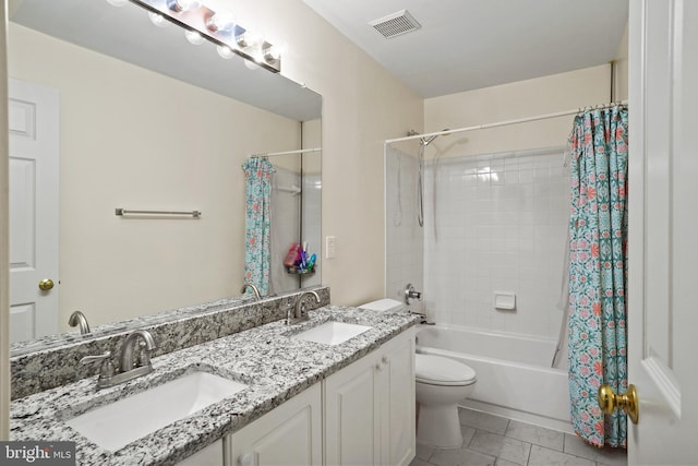 full bathroom featuring toilet, shower / bath combination with curtain, a sink, and visible vents