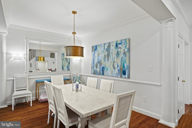 dining room with dark wood finished floors, decorative columns, and crown molding