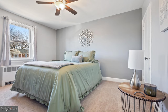 bedroom with baseboards, ceiling fan, light colored carpet, and radiator