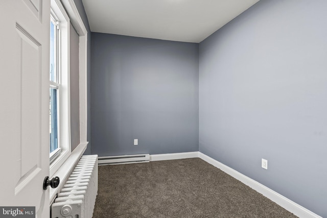 carpeted empty room featuring a baseboard heating unit, radiator, plenty of natural light, and baseboards