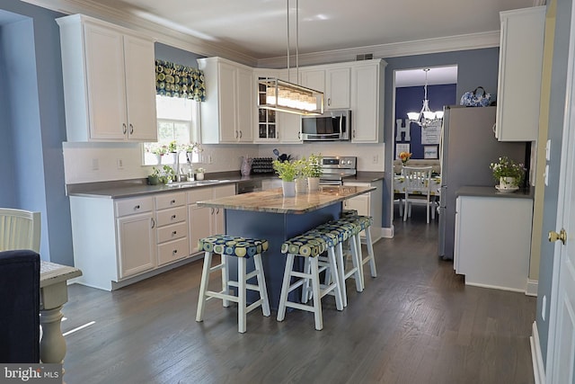 1 Longfellow Ln, Hainesport, NJ 08036 - kitchen with appliances with stainless steel finishes, white cabinets, a kitchen breakfast bar, a sink, and a kitchen island