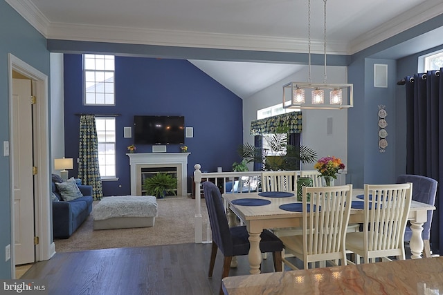 1 Longfellow Ln, Hainesport, NJ 08036 - dining area featuring wood finished floors, plenty of natural light, crown molding, a glass covered fireplace, and lofted ceiling