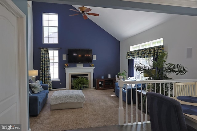 1 Longfellow Ln, Hainesport, NJ 08036 - carpeted living room featuring ceiling fan, high vaulted ceiling, plenty of natural light, and a glass covered fireplace