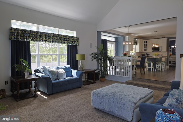 1 Longfellow Ln, Hainesport, NJ 08036 - living room with lofted ceiling, carpet floors, and a chandelier