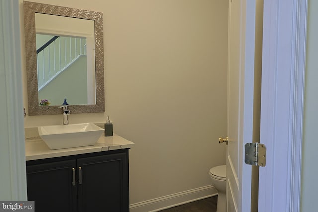 1 Longfellow Ln, Hainesport, NJ 08036 - half bathroom featuring toilet, vanity, baseboards, and wood finished floors