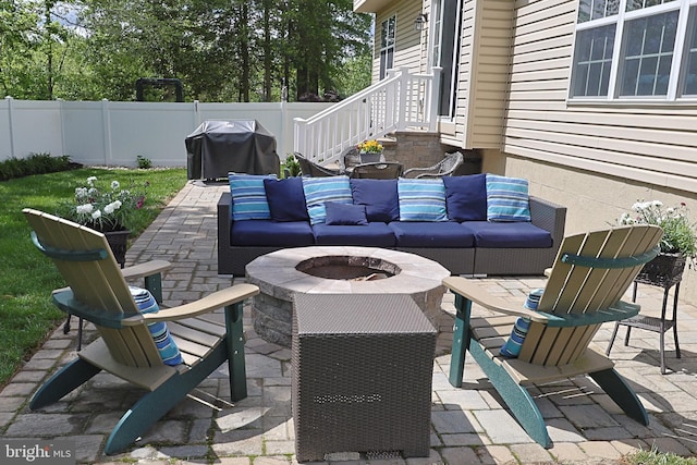 1 Longfellow Ln, Hainesport, NJ 08036 - view of patio featuring fence, a grill, and an outdoor living space with a fire pit