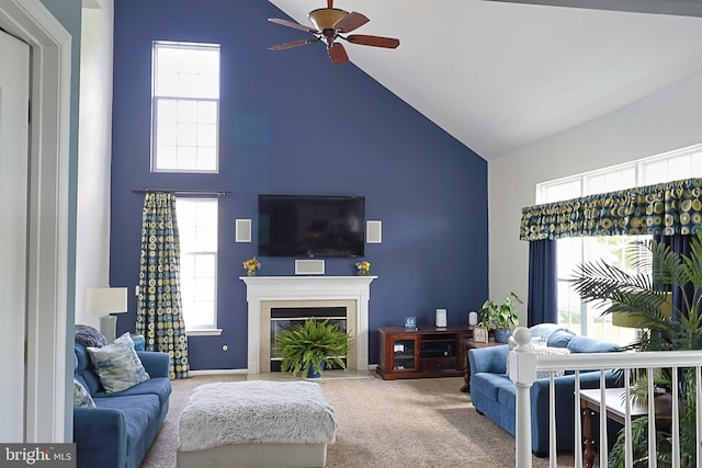 1 Longfellow Ln, Hainesport, NJ 08036 - living area with high vaulted ceiling, a ceiling fan, carpet, a glass covered fireplace, and plenty of natural light