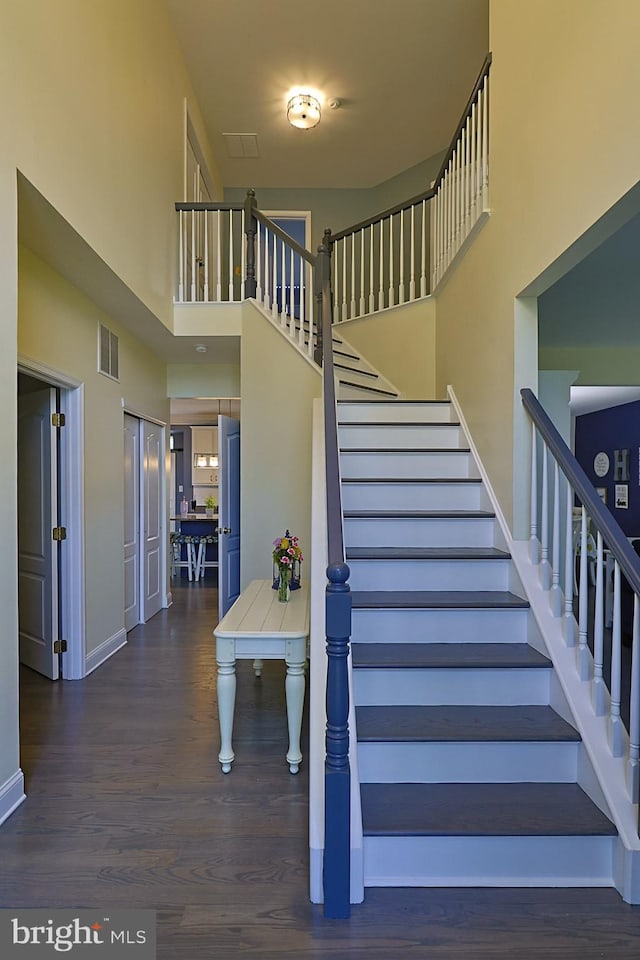 1 Longfellow Ln, Hainesport, NJ 08036 - staircase with wood finished floors, a towering ceiling, and baseboards