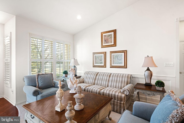 living room featuring vaulted ceiling