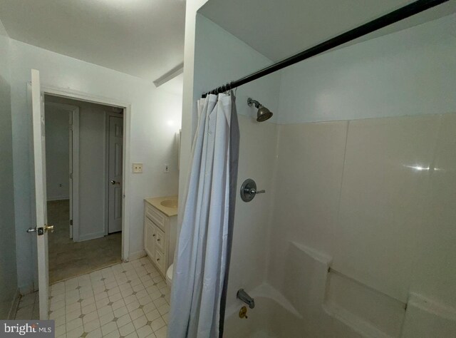 full bathroom featuring vanity and shower / tub combo with curtain