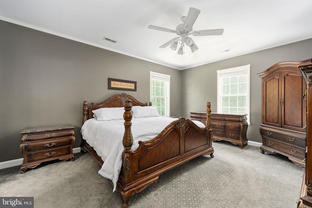 bedroom with light carpet, baseboards, visible vents, and crown molding