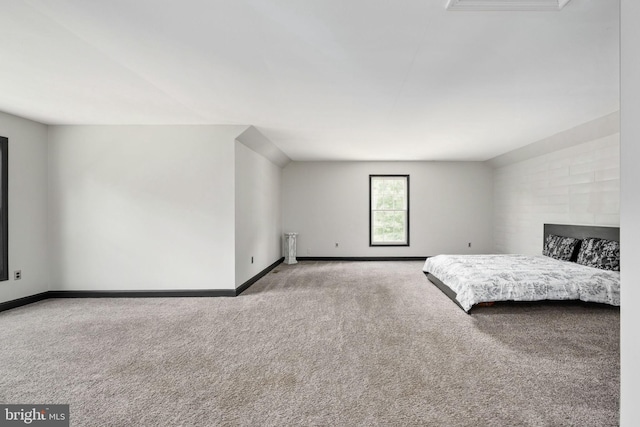 bedroom with carpet and baseboards