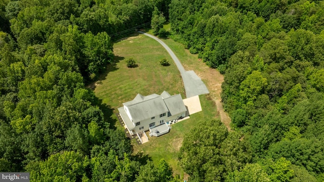 bird's eye view featuring a forest view