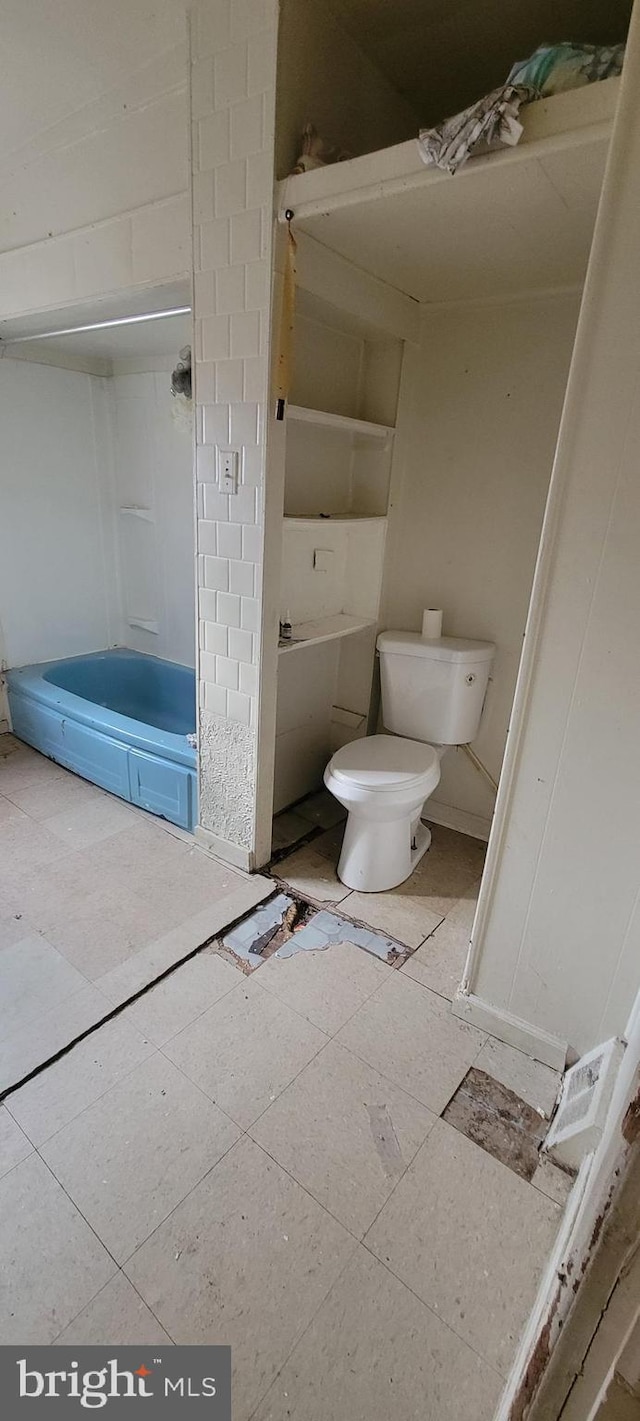 full bath featuring toilet and a shower