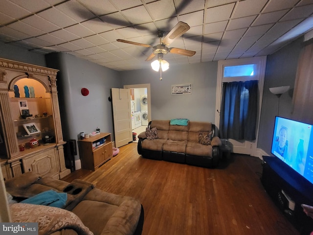living room featuring ceiling fan and wood finished floors