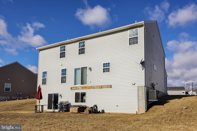 rear view of house with a lawn