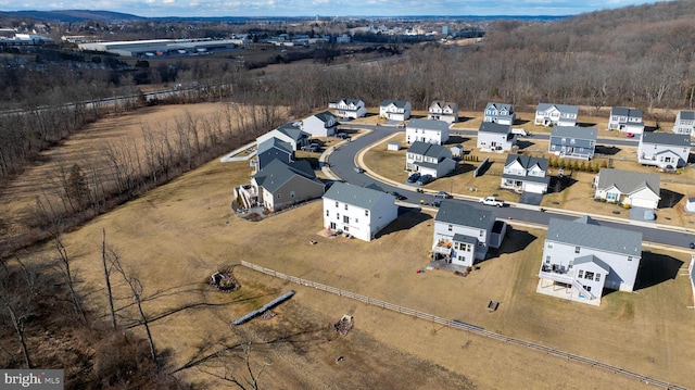 birds eye view of property with a residential view