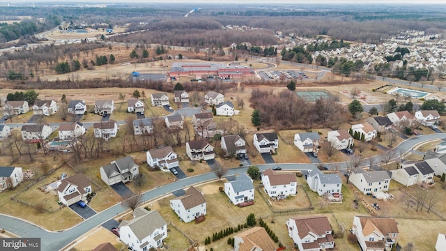 birds eye view of property with a residential view