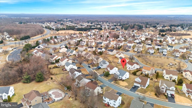 birds eye view of property with a residential view