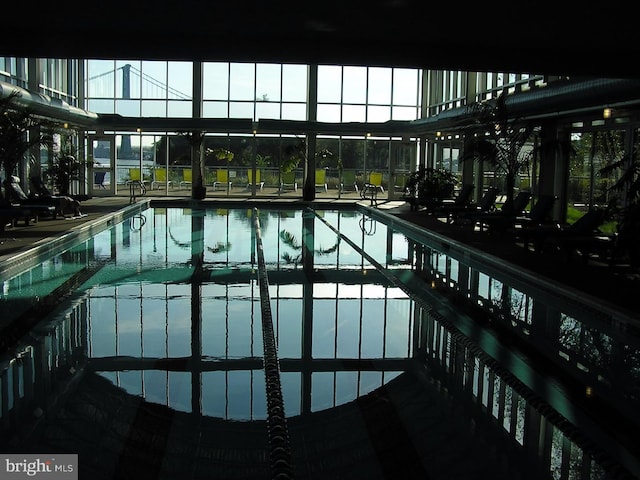 community pool featuring a patio and a lanai