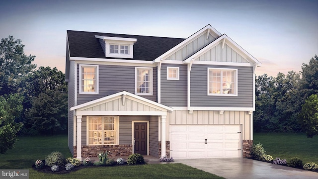 view of front facade featuring concrete driveway, an attached garage, board and batten siding, stone siding, and a front lawn