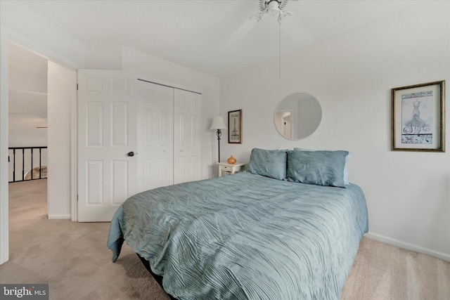 bedroom featuring a closet, carpet, a ceiling fan, and baseboards