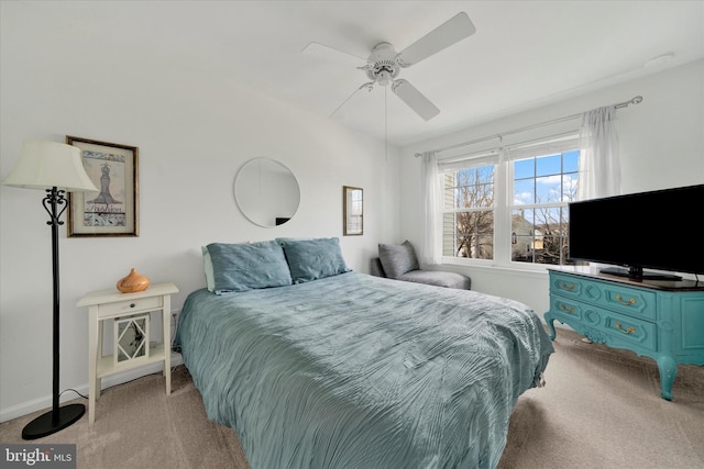 bedroom with ceiling fan, carpet, and baseboards