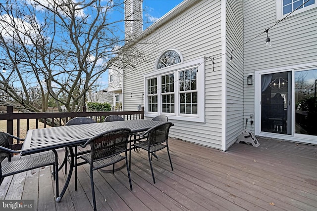 wooden deck with outdoor dining area