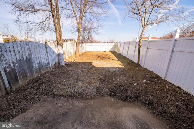 view of yard with a fenced backyard