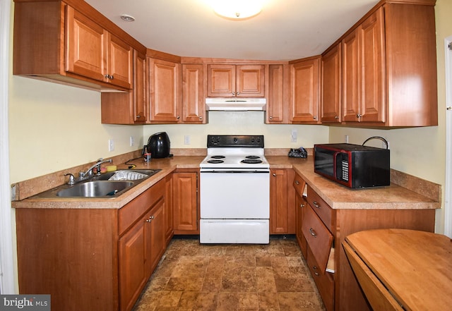 kitchen with brown cabinets, white electric range, a sink, black microwave, and under cabinet range hood