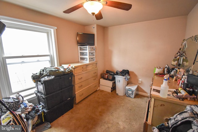 bedroom with light carpet, ceiling fan, and baseboards