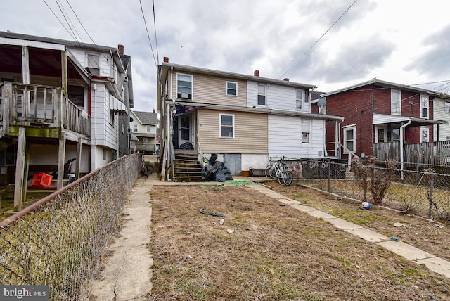 back of property featuring fence