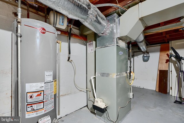 utility room featuring water heater