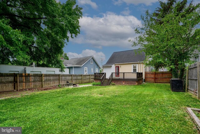 view of yard featuring a wooden deck