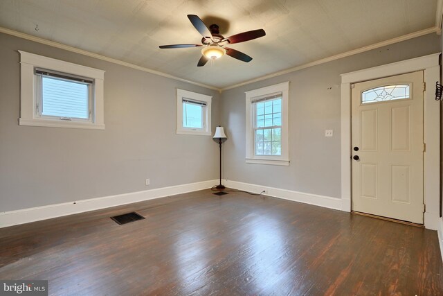 entryway with dark wood-style floors, a ceiling fan, baseboards, and ornamental molding