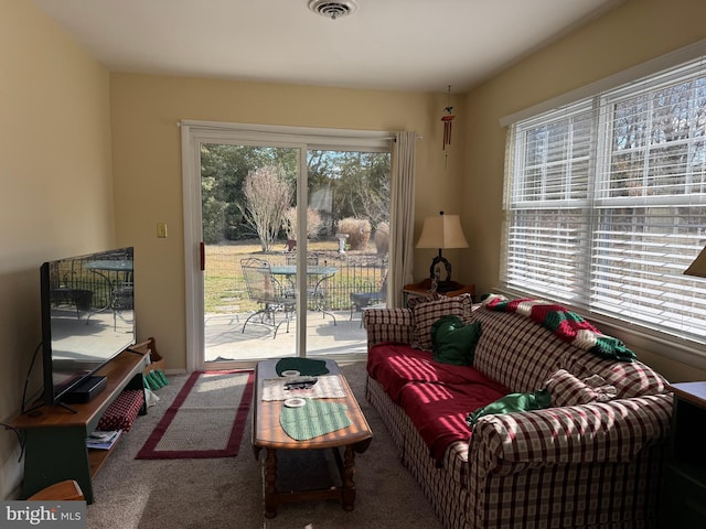 living room featuring carpet and visible vents