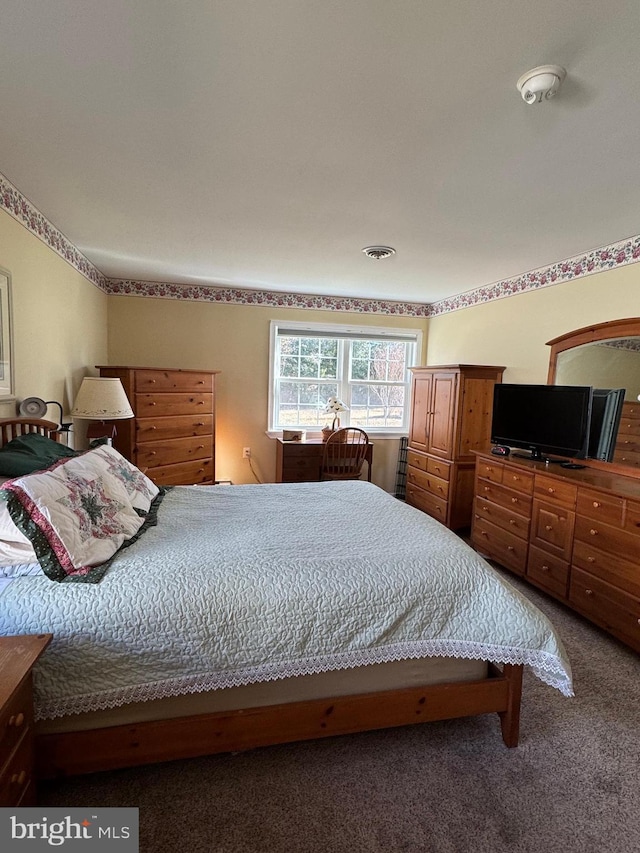 carpeted bedroom with visible vents