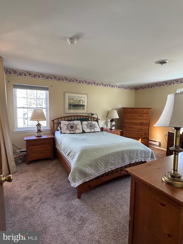 bedroom with a baseboard radiator, carpet, and visible vents