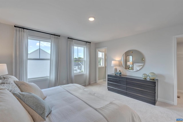 bedroom with carpet and baseboards