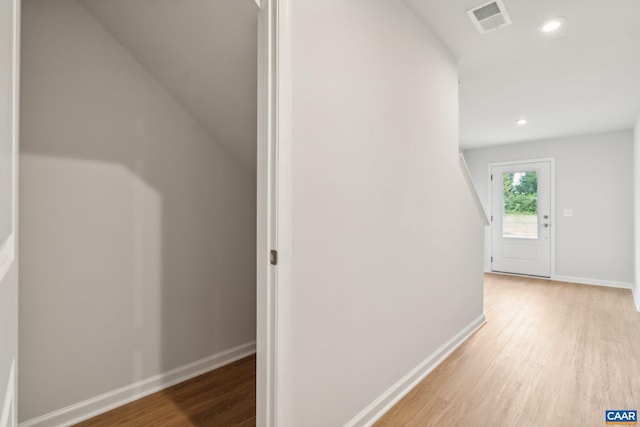 corridor with visible vents, baseboards, wood finished floors, and recessed lighting