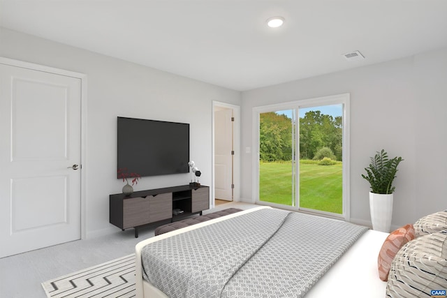 bedroom featuring access to exterior, carpet flooring, and recessed lighting