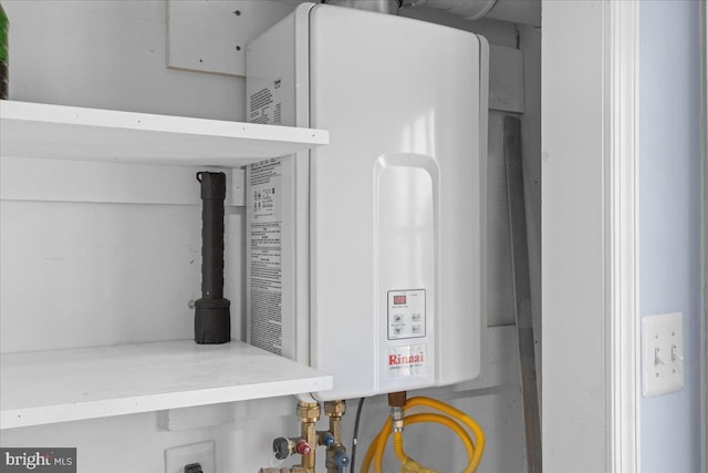 utility room featuring water heater