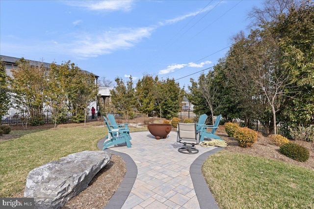 view of home's community featuring fence, a patio, and a yard