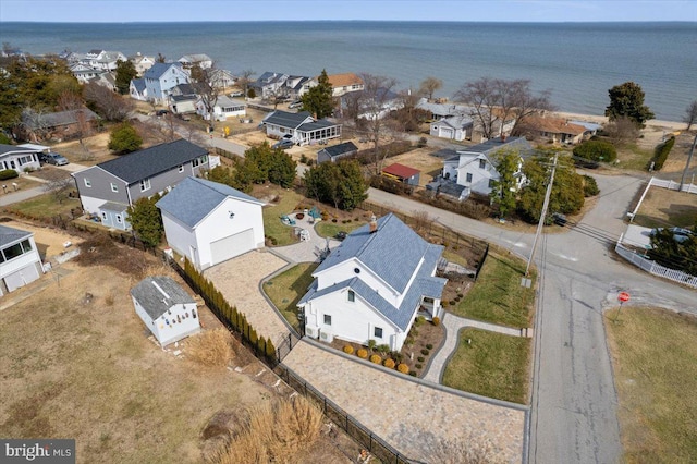 aerial view featuring a water view and a residential view