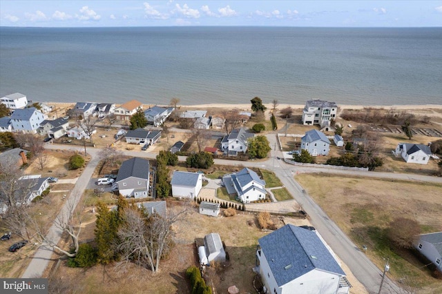 birds eye view of property featuring a water view and a residential view